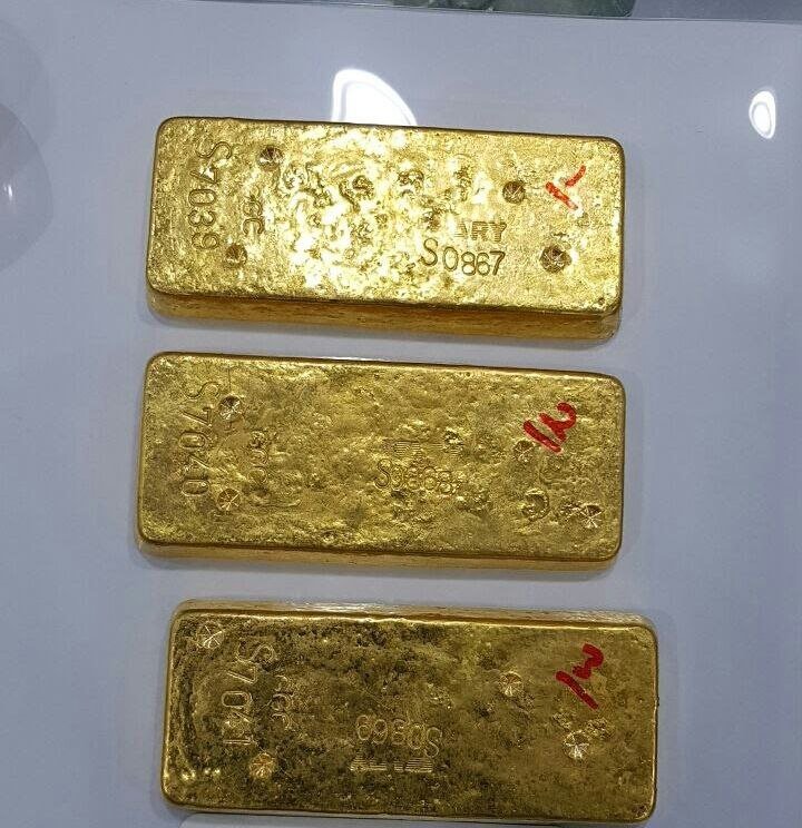 3 gold bars with serial numbers